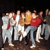 Before the organised and multi-million pound Edinburgh Hogmanay celebrations were introduced in the late 90s, Edinburgers brought in the bells at the Tron, off the High Street at Hunter Square. Teenagers pictured having a knees-up at the Tron Kirk in Edinburgh on Hogmanay 1990.