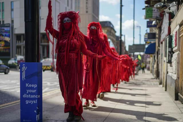 Extinction Rebellion's Red Rebels will take part in Saturday's energy price protest in Edinburgh.  Photo: Christopher Furlong/Getty Images.