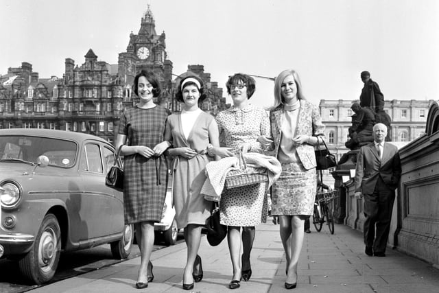 Four women with summer dresses on make their way to work on North Bridge in 1966.