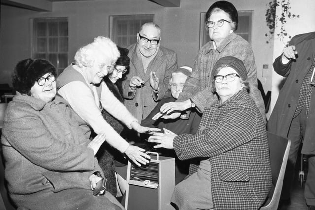 Old people at Dalry House huddling round a single paraffin heater during the power cuts caused by the miners' strike of February 1972.