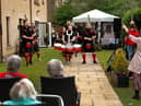 Residents, staff and guests at two Edinburgh nursing homes were treated to highly-charged live performances by the Red Hot Chilli Pipers as part of the celebrations for Care Home Open Week. Photo: Graham Clark