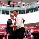 Labour leader Keir Starmer and his Scottish counterpart Anas Sarwar greet supporters during the launch of the Scottish Labour general election campaign (Photo by Jeff J Mitchell/Getty Images)