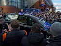 Fans gathered as the funeral car passed by Ibrox.