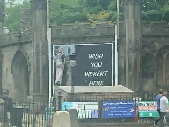 The billboard has appeared outside St John's on the corner of Lothian Road and Princes Street. PIC: Contributed.