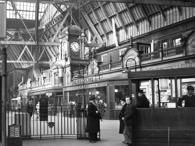 The interior of Princes Street Station showing a platform entrance and the ornate refreshments bar in 1963.