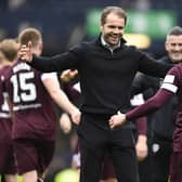 Cammy Devlin and manager Robbie Neilson embrace at full time