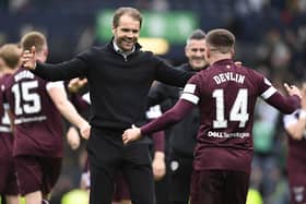 Cammy Devlin and manager Robbie Neilson embrace at full time