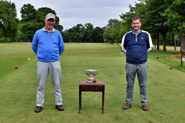 Neil Sneddon, right, with club captain Armar Johnston after claiming the Ratho Park title for the eighth time across four decades