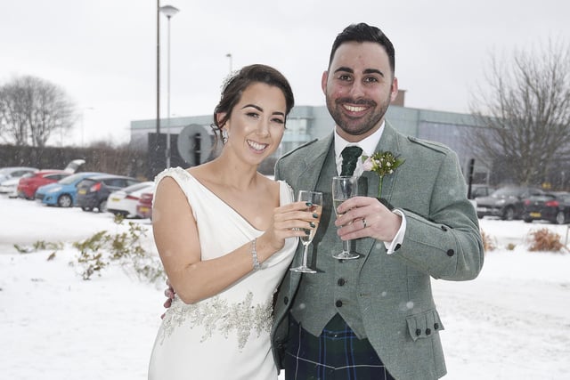 One local got married in the midst of the storm at The Village hotel in Crewe Toll, Edinburgh. The happy couple braved the freezing cold temperatures to have a quick picture taken, but avoided standing in the snow as the bride's shoes were too expensive.