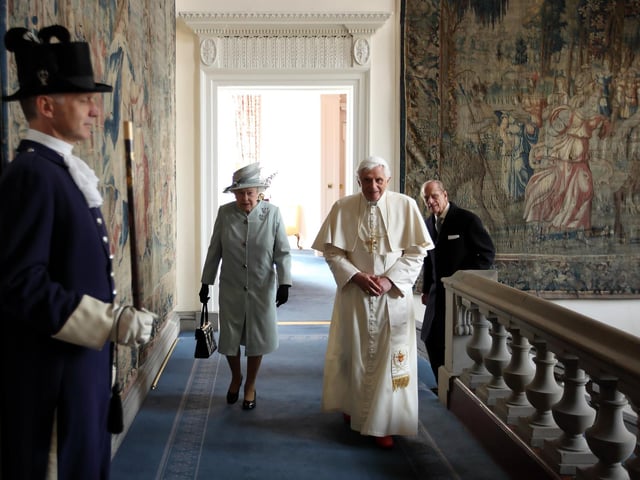 Queen Elizabeth II and Prince Philip, Duke of Edinburgh, walking with Pope Benedict XVI in the Palace of Holyroodhouse, the Queen's official residence in Scotland, on September 16, 2010.
