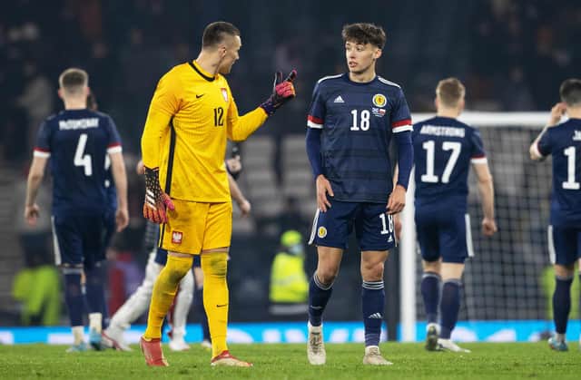 Aaron Hickey chats to Bologna team-mate Łukasz Skorupski after making his debut for Scotland. (Photo by Alan Harvey / SNS Group)