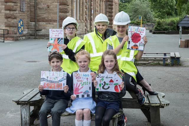 Dandara Homes speed poster competition winners from King's Park Primary. Alison Gardiner, Sales Consultant from Dandara East Scotland is in the middle with the pupils.
