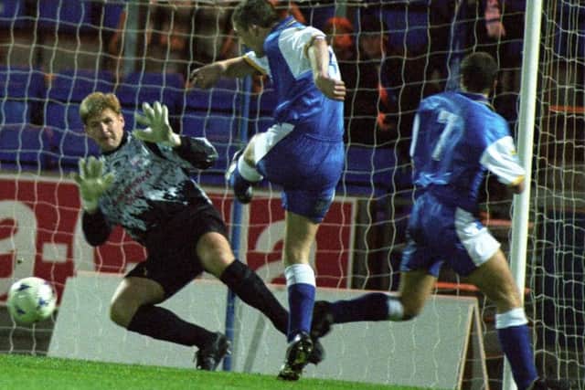 David Larter in action for Montrose against St Johnstone in the 1990s. Larter holds Montrose's all time record for number of appearances.