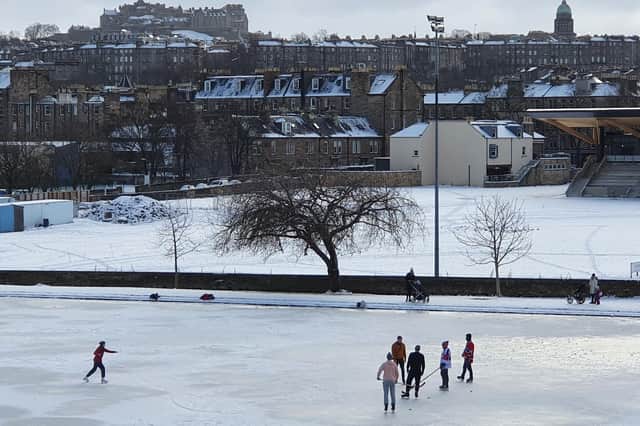 Edinburgh residents taking a break from a game of Ice Hockey on Inverleith Pond on Friday.