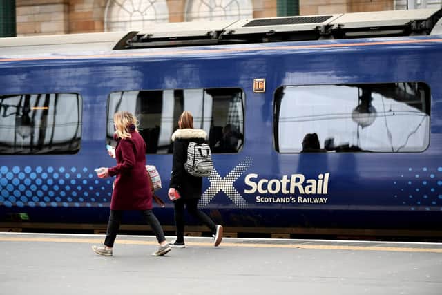 Passengers board a ScotRail train at Glasgow Central Station picture: John Devlin