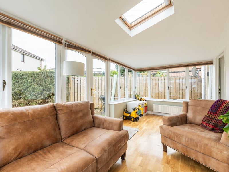 The addition of a sunroom at the South Queensferry home provides a serene family space to relax and enjoy the natural surroundings.