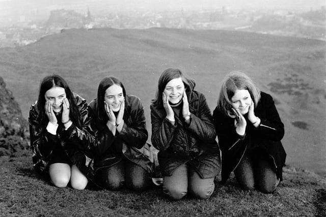 Four girls wash their faces in the dew at the top of Arthur's Seat Edinburgh on May Day 1969.