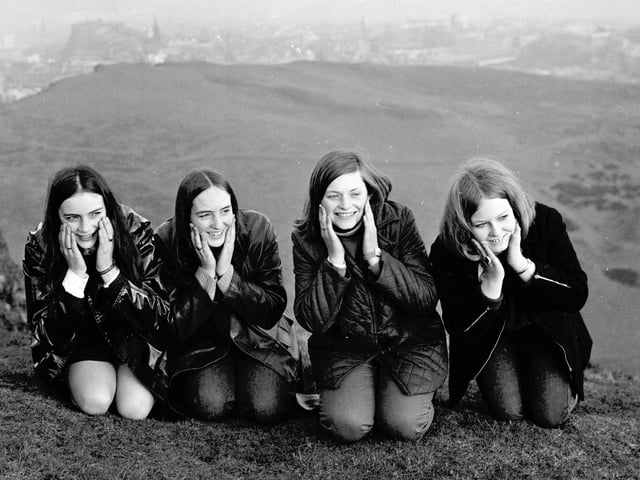 Four girls wash their faces in the dew at the top of Arthur's Seat Edinburgh on May Day 1969.