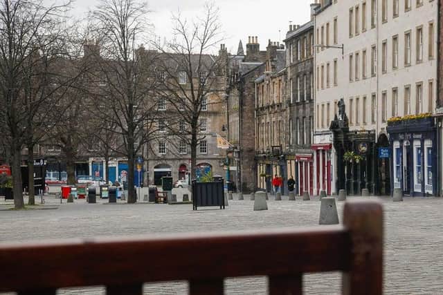 Pubs and restaurants in Edinburgh's Grassmarket have been hit by restrictions