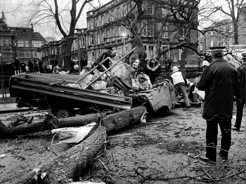 Firemen in the Meadows in Edinburgh where a 50-ft tree was blown down and fell on a truck, killing the driver Stanislaw Jakubanes of Largs. The passenger, Danuta Maj was trapped in the cab and broke both legs (December 1982)