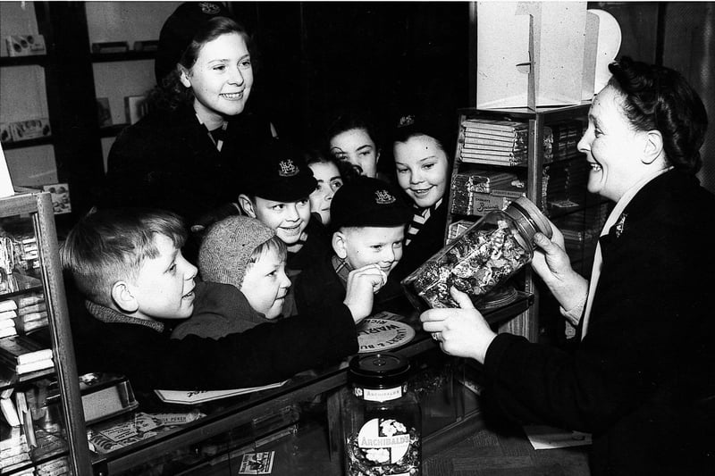 Children from Moray House School rush to an Edinburgh sweet-shop on the morning of 5/2/1953 as sweet rationing ends.