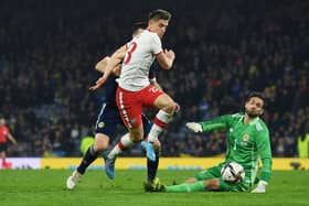 Poland's Krzysztof Piatek throws himself to ground after going past Craig Gordon late in stoppage time. Picture: SNS