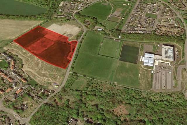 The former school site marked in red, with the new school pictured on the right.
