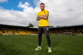 Anthony Stokes after being unveiled as a Livingston player, standing on the artificial pitch the West Lothian side also train on. Picture: SNS