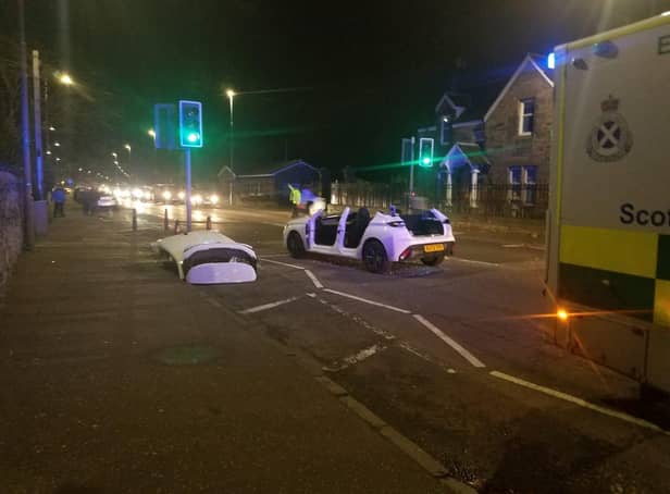 A car was seen with its roof cut off and lying next to the vehicle