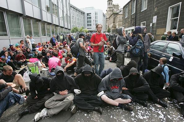 Protesters stage a sit-down protest in the financial district of Edinburgh  July 4 2005