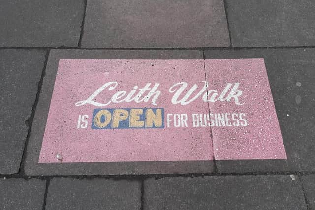A sign reads 'Leith Walk is open for business"