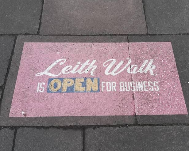 A sign reads 'Leith Walk is open for business"
