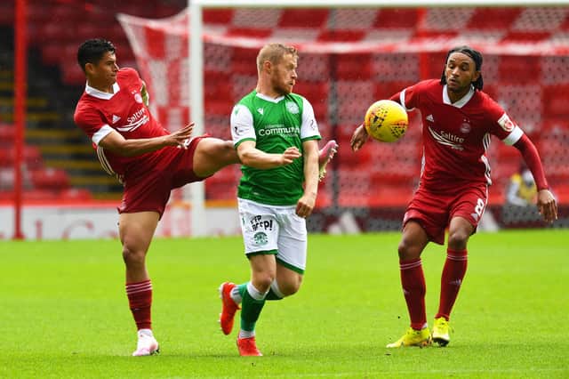 Daryl Horgan battles with Funso Ojo during a pre-season clash between Hibs and Aberdeen at Pittodrie