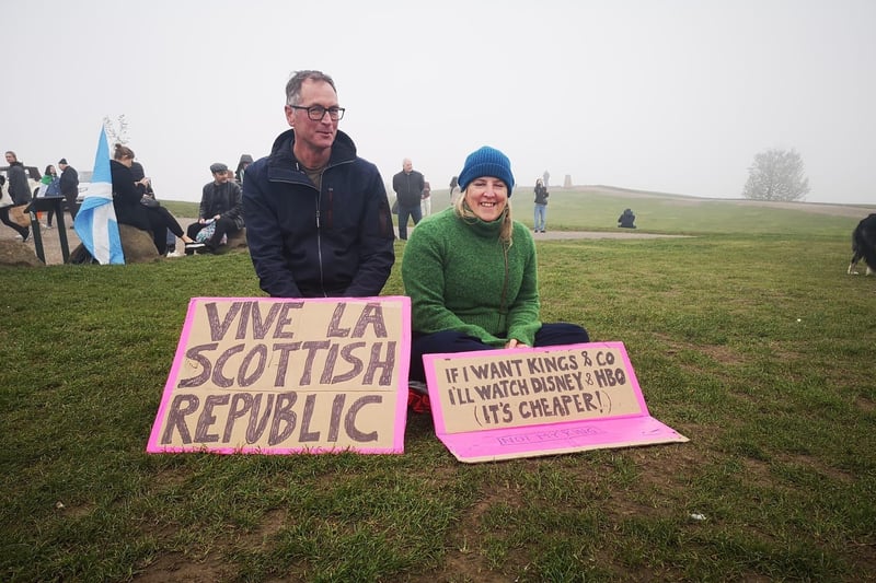 One protesters sign reads: "If I want Kings and co I'll watch Disney and HBO (it's cheaper!)" while another says: "Vive la Scottish republic!"
