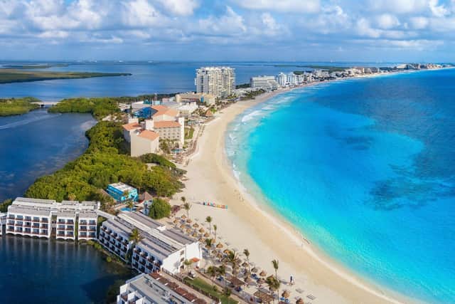 Some of the hot destinations to choose from include Cancun in Mexico. Photo: Jonathan Ross / Getty Images / Canva Pro.
