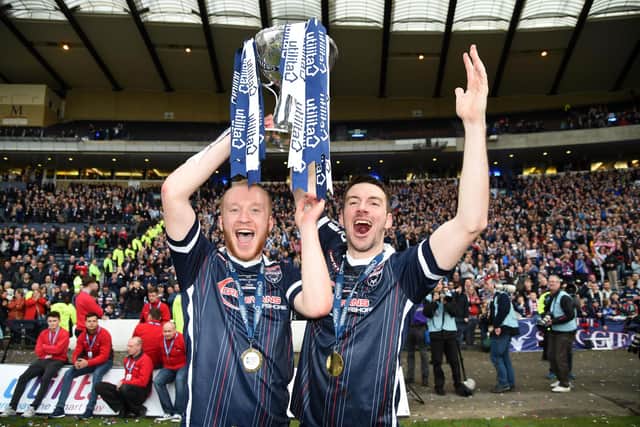 Liam Boyce, left, celebrates after helping Ross County to win the League Cup in 2016. Picture: SNS