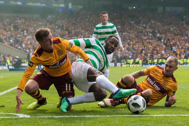 Frear, left, competes with Moussa Dembele against Celtic in 2018.