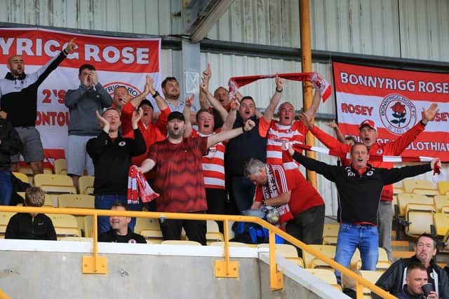 Bonnyrigg Rose supporters celebrate after their team's victory sends them to the top of League 2. Picture: Joe Gilhooley LRPS