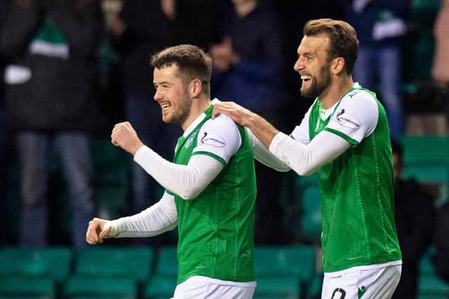 Marc McNulty celebrates a goal with Christian Doidge against Ross County