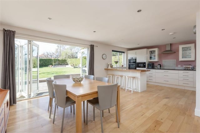 Dining area / kitchen with bi-fold doors to rear garden.