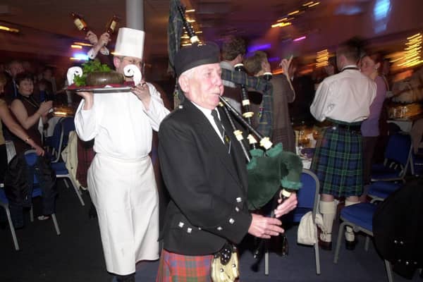 The haggis is piped in at the 'world's biggest burns supper' at Edinburgh's Corn Exchange in 2003.