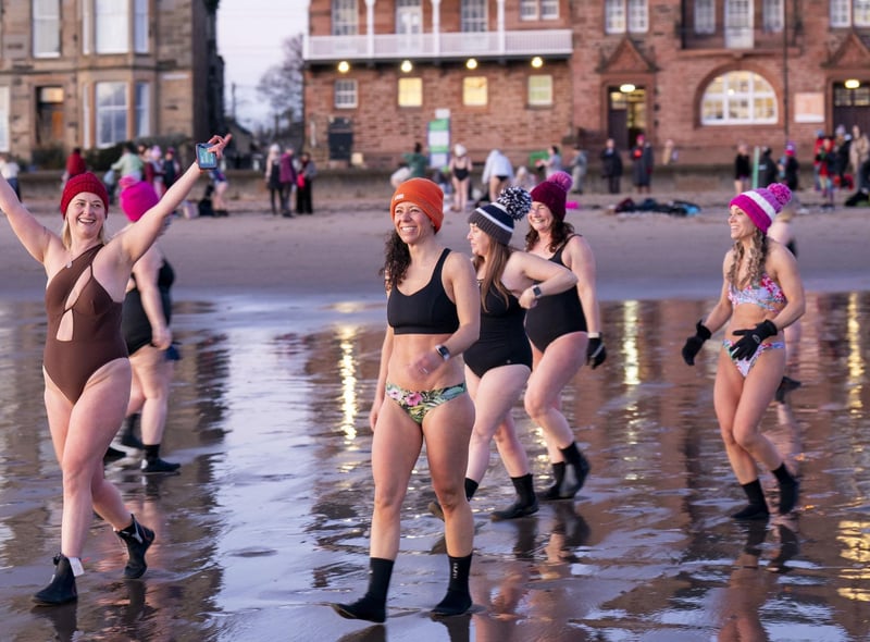 Several women smiled as they prepared for their swim, despite the freezing cold temperatures.