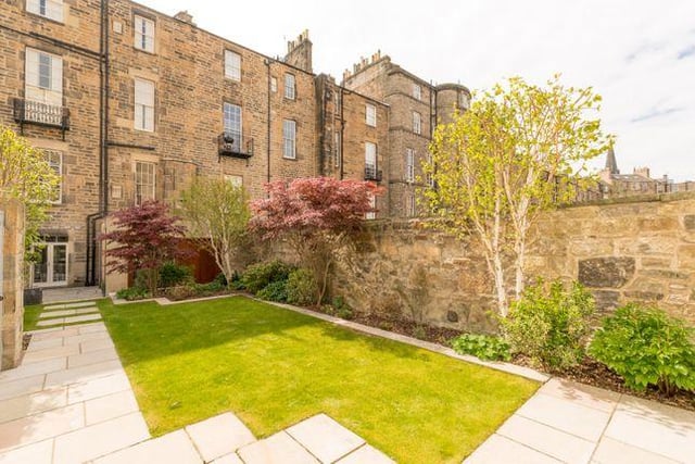 To the back of the property is a walled landscaped garden with a path that leads to a double garage with electric security doors. To the front of the property is a private courtyard with three cellars