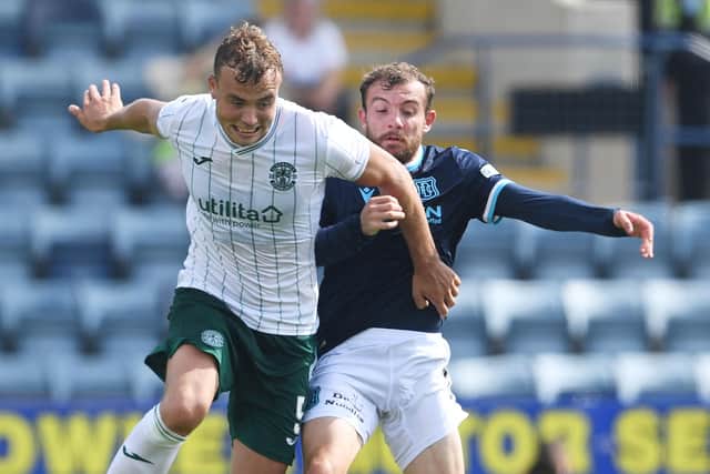 Ryan Porteous looks to get the better of Dundee's Paul McMullan