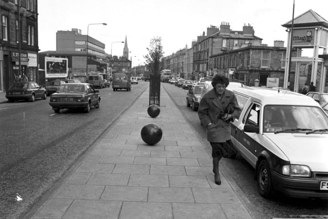 Community art - large balls painted black were set into the central reservation in Edinburgh's Leith Walk, April 1990.