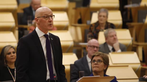 Deputy First Minister John Swinney MSP was watched by First Minister Nicola Sturgeon as he delivered his budget to the Scottish Parliament.Picture: Andrew Cowan/Scottish Parliament/PA Wire