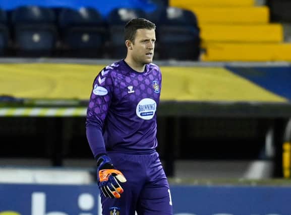 Hearts keeper Colin Doyle is to stay on loan at Kilmarnock.