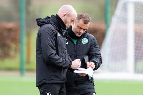 Hibs manager Shaun Maloney in discussion with first-team coach David Gray during training on Thursday.  (Photo by Mark Scates / SNS Group)