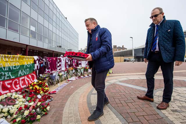 Inverness manager John Robertson and CEO Scot Gardiner lay a wreath on behalf of Inverness Caledonian Thistle in tribute to former Hearts captain Marius Zaliukas.