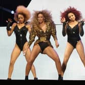 Beyonce (centre), with backing dancers, performing on the Pyramid Stage at the Glastonbury Music Festival in 2011. Beyonce gets set to release her first full-length solo album since 2016, a sprawling 16-track record featuring contributions from her husband Jay-Z, Drake, producer Skrillex and The-Dream.
